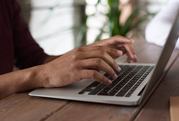 person using macbook.jpg